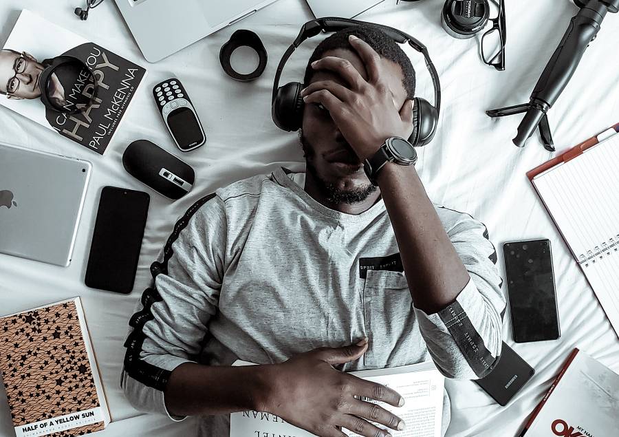 man lying dow with headphones on